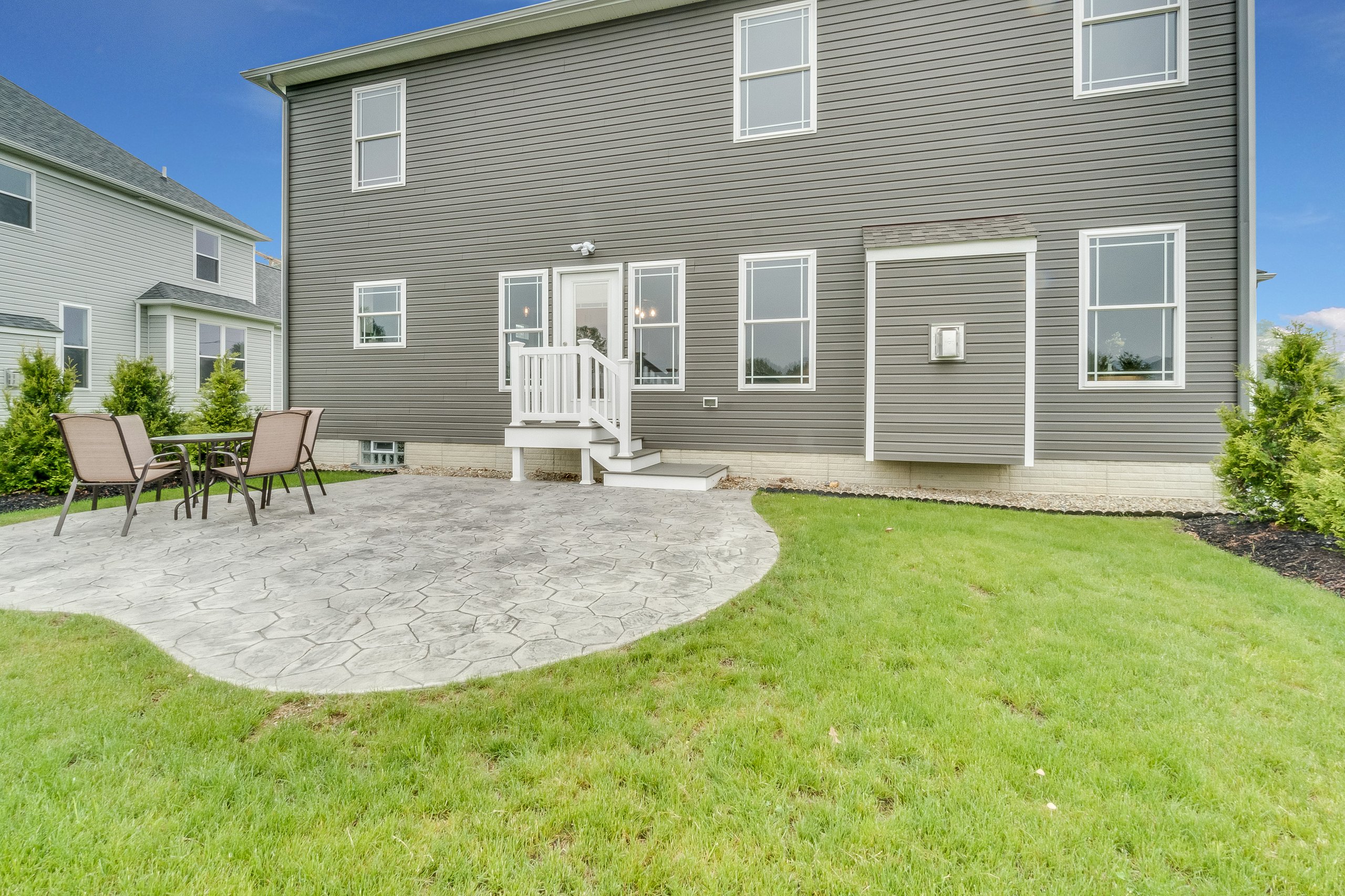Standard concrete patio with grass
