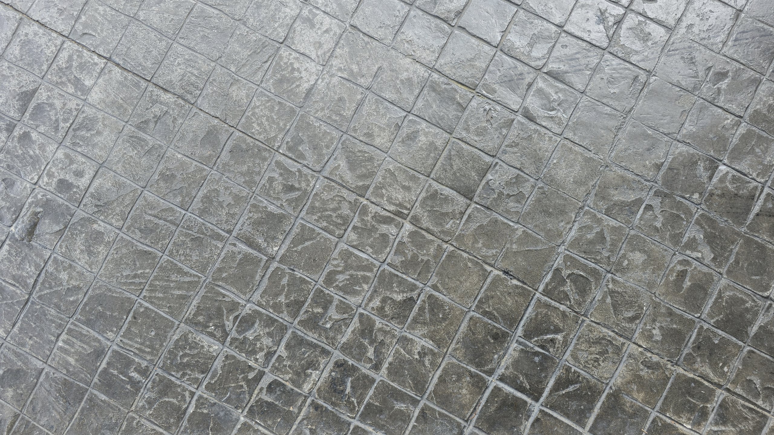 Stamped concrete with stone-like grid pattern